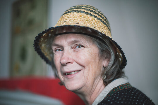 Portrait of senior woman wearing straw hat