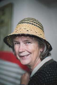 Portrait of senior woman wearing straw hat