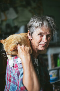 Senior woman with car on shoulders