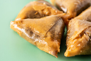 Almond briwat on green background. Traditional Moroccan dessert