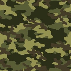 Fototapeta premium Green camouflage pattern military texture on textile. Repeat print. Fashionable background. Vector