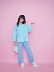 Young woman on pink background