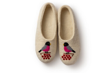 Felt slippers on white background in closeup