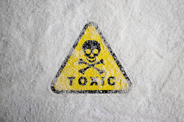 white chemical powder with toxic sign