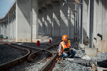 engineer sitting on railway inspection. construction worker on railways. Engineer work on railway.rail,engineer,Infrastructure