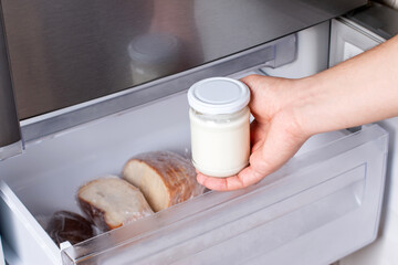 Frozen dairy products. Frozen sour cream in the freezer