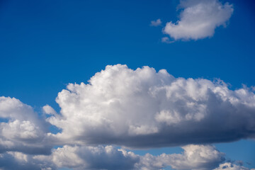 Naklejka na ściany i meble Beautiful blue sky with fluffy white clouds
