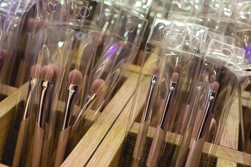 Closeup of a set of cosmetic makeup brushes for sale at a beauty store.