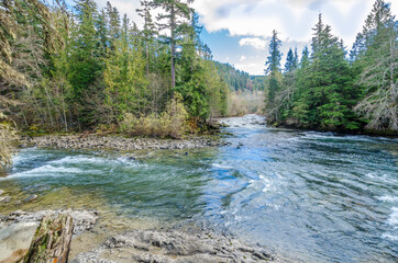 Beautiful Mountain River and suspention bridge at Cal Cheak Recreation Site, Sea-to-Sky Hwy,...