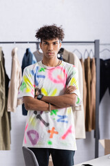 African american showroom owner with crossed arms looking at camera