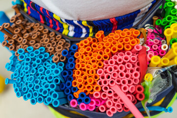 a colorful balloons in hip bags of clown at outdoor festival.