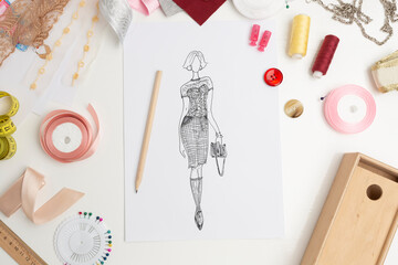 Fashion design. Sketches of stylish women's clothing. Designer drawings of dresses on paper.