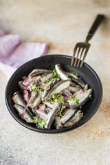 anchovy salty fish seafood  small herring marinated salad appetizer healthy vegetarian pescetarian meal top view copy space food background 
