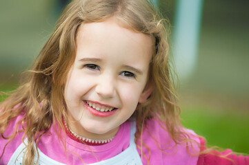 Close up of a smiling active little girl