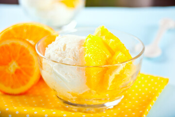 Homemade fresh orange ice cream with orange slices. Summer dessert.