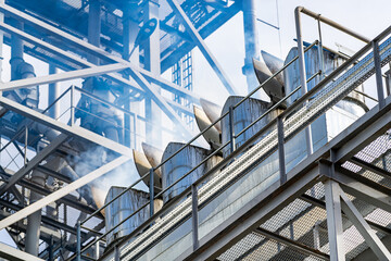 Steel frame structure building at construction site. Selective focus on part of a metal frame. Closeup.