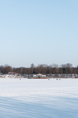 Fototapeta na wymiar fishermen on the winter river