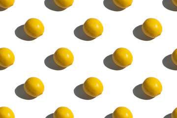 Yellow lemon on a white background. Lemon pattern on a white background. Hard shadows