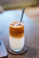 coffee and Laptop on wooden table background. use in Traditional Chinese Alphabet operating system.