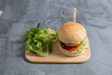Hamburger, burger, steak, tomato, sauce and lettuce tasty meat snack sandwich menu concept. food background. front view. copy space