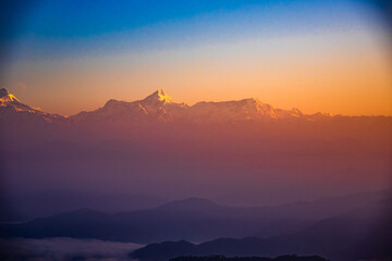 Fototapeta na wymiar View of Himalays during sunrise at Binsar, a hill station in Almora district, Uttarakhand, India.