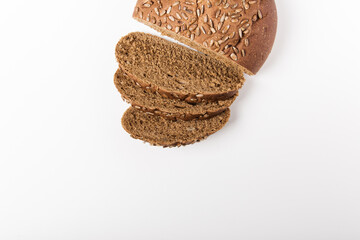 whole grain bread with seeds on the white background. top view. healthy food. space for text