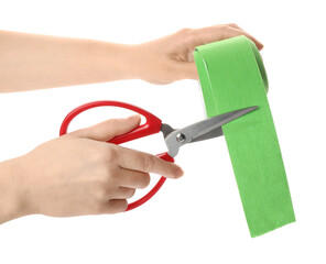 Woman cutting bright kinesio tape on white background, closeup