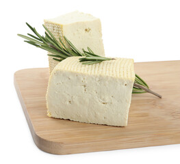 Pieces of delicious tofu with rosemary on white background. Soybean curd