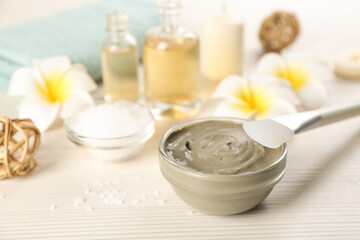 Composition with cosmetic product for spa body wraps on white wooden background