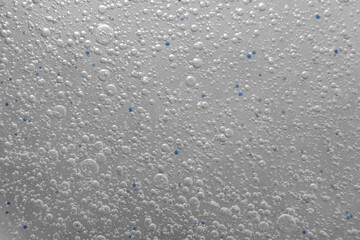 Gel with oxygen bubbles. Abstract transparent liquid background. Antibacterial gel, hyaluronic acid. macro close-up