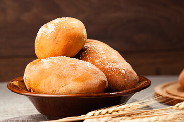 pies on a plate on a dark background