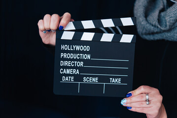 cinema clapperboard board on dark background