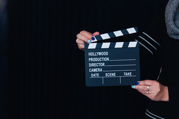 cinema clapperboard board on dark background