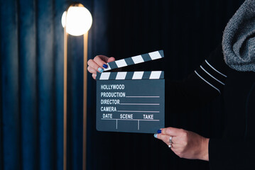 cinema clapperboard board on dark background