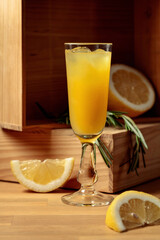 Limoncello on a wooden table.