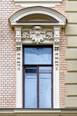 Window with an arched visor.