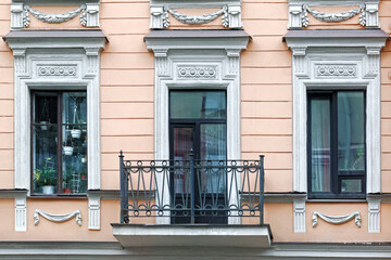 Two  windows and a balcony.