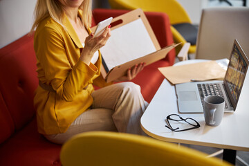 Close up of busy female reading income message