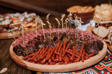 Slicing different types of meat. Wedding buffet