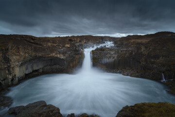 Fototapeta premium Aldeyjarfoss waterfall in Northeast Iceland. Beautiful nature icelandic landscape at dramatic cloudy sky