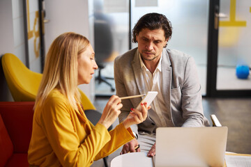 Concentrated male person staring at screen of gadget