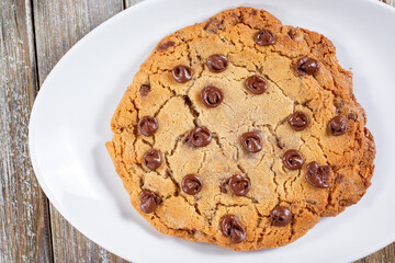A top down view of a large chocolate chip cookie.