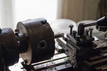 metalworking industry: working on a lathe with flying sparks. Lathe