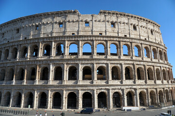 Fototapeta premium Ancient roman Colosseum in a sunny day. Facade of the famous Roman amphitheater. Ancient architecture and art.