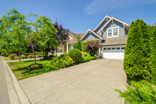 A perfect neighbourhood. Houses in suburb at Summer in the north America. Luxury houses with nice landscape.