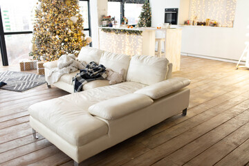 corner sofa in white. New Year's interior in the living room. room interior