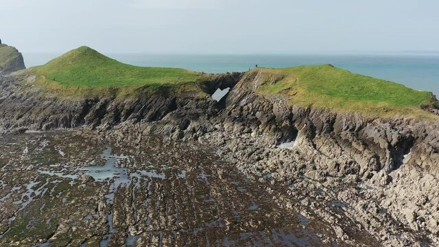 Aerial view of a spectacular coastline at low tide (Worms Head, Wales)
