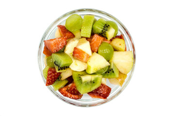 Fruit salad in bowl isolated on white background top view