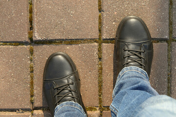 Black formal shoes on tile