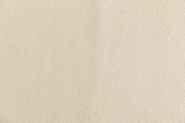 Fototapeta na wymiar smooth surface of light cream fleece, background, texture